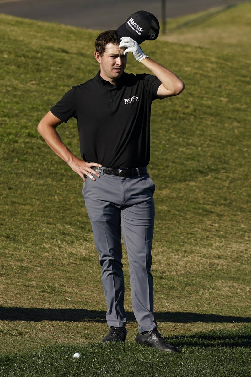 Patrick Cantlay measures his putt from the rough to the 16th hole during the final round of The ...
