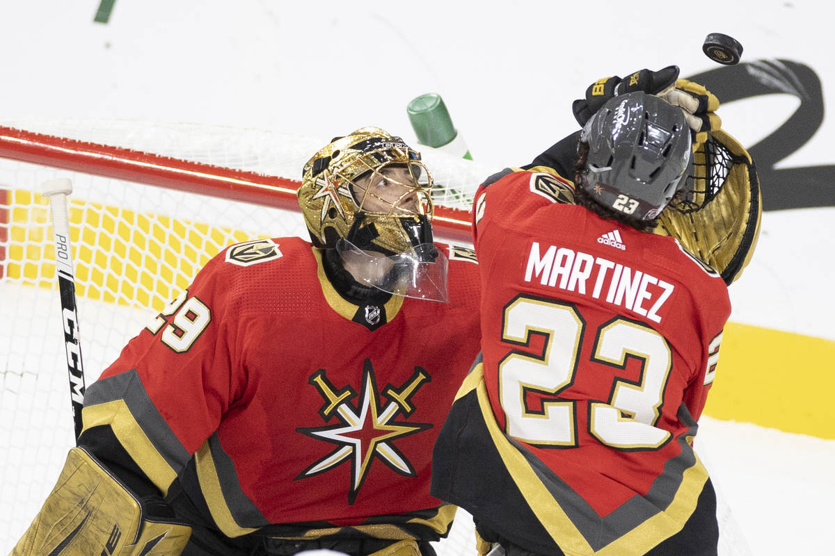 Vegas Golden Knights goaltender Marc-Andre Fleury (29) makes a save with the help of Vegas Gold ...