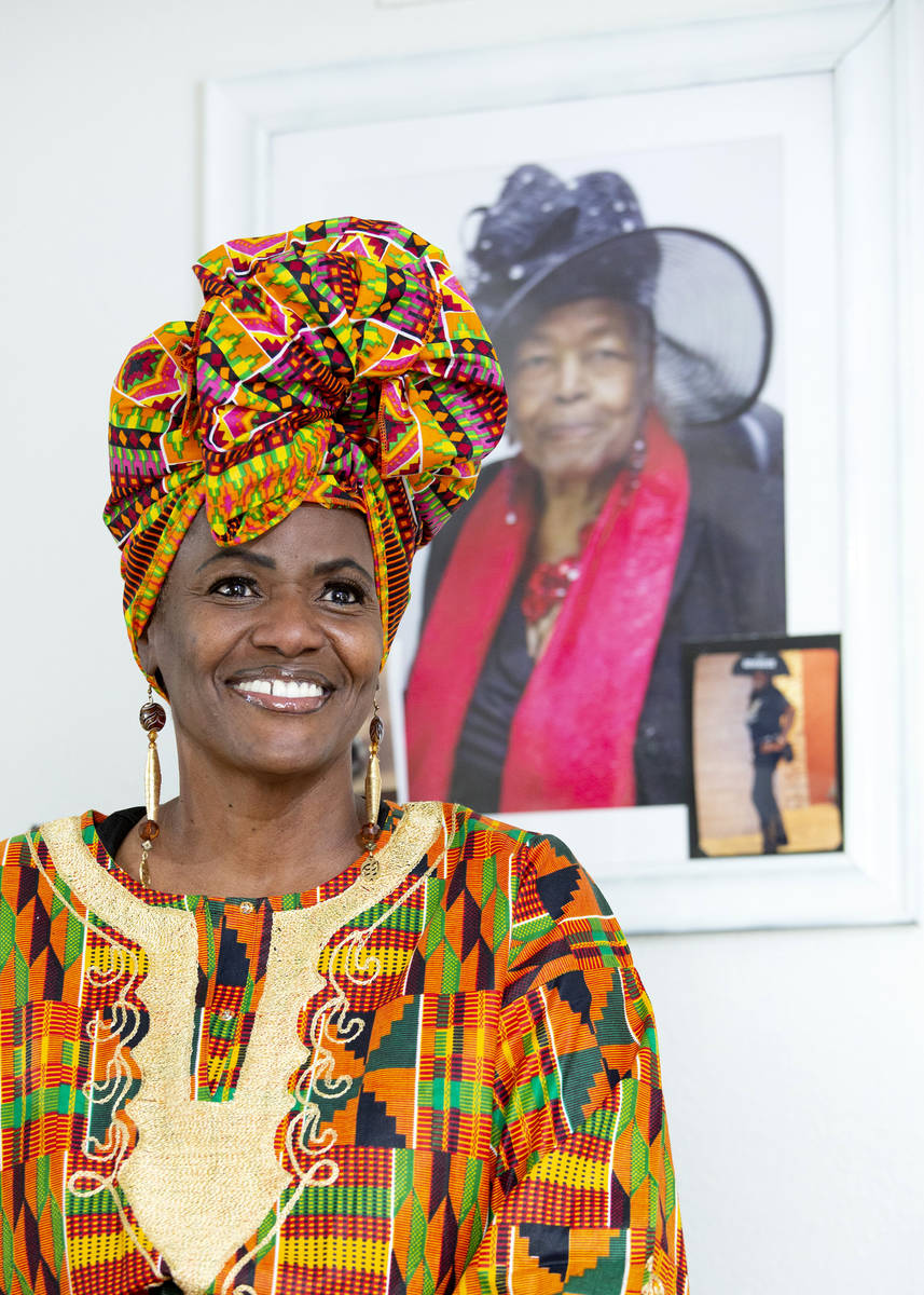 Yvonne Wesley, daughter of Black activist Mary Wesley, poses for a portrait with her mother's p ...