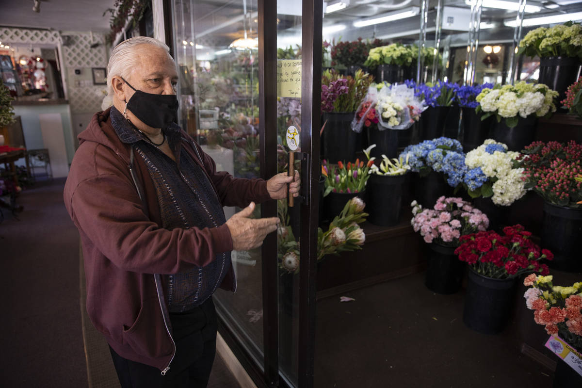 John DiBella, co-owner of DiBella Flowers & Gifts, gives a tour of his Las Vegas shop while ...