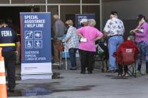 People lined up to get their second doses of vaccine at the Las Vegas Convention Center's vacci ...