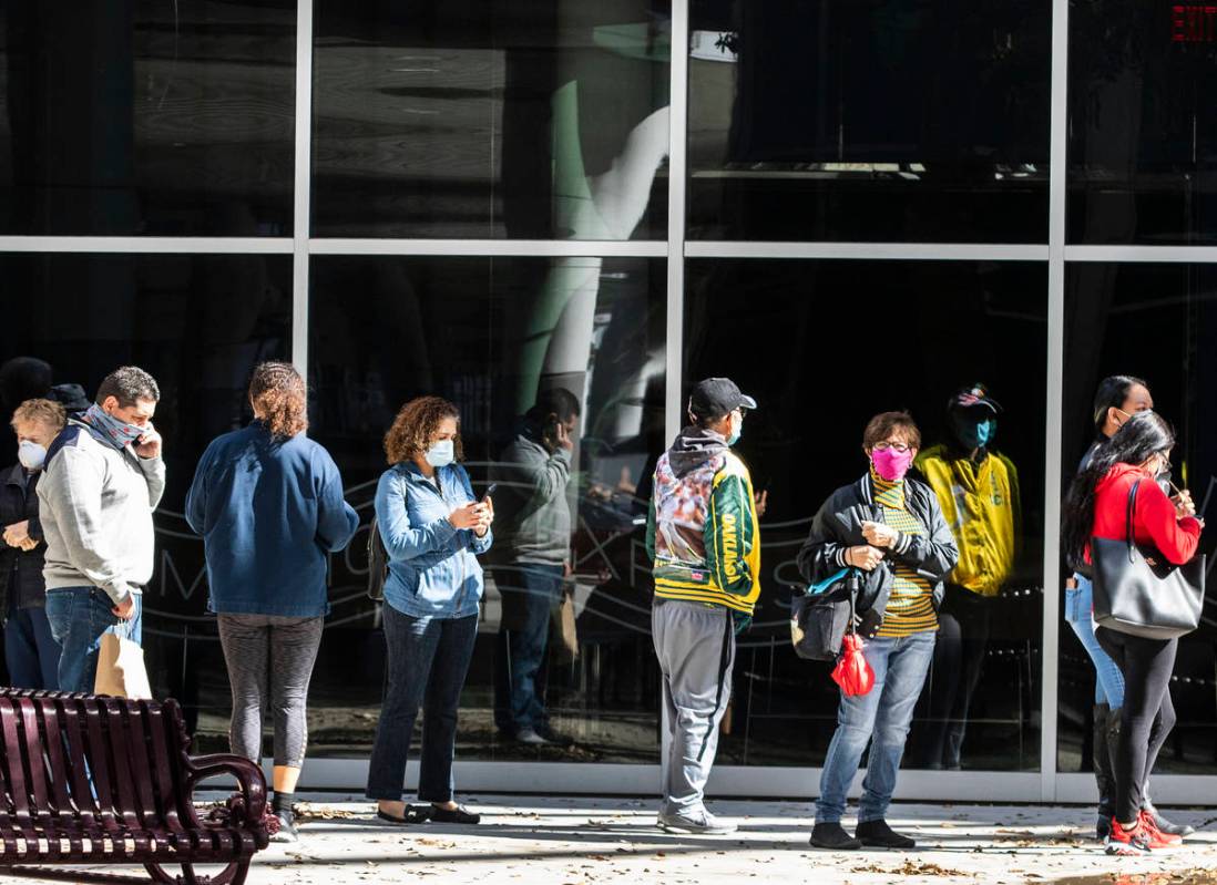 People lined up to get their second doses of vaccine at the Las Vegas Convention Center's vacci ...