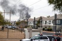 Black smoke is seen from an apartment at Milan Apartment Townhomes on East Silverado Ranch Boul ...