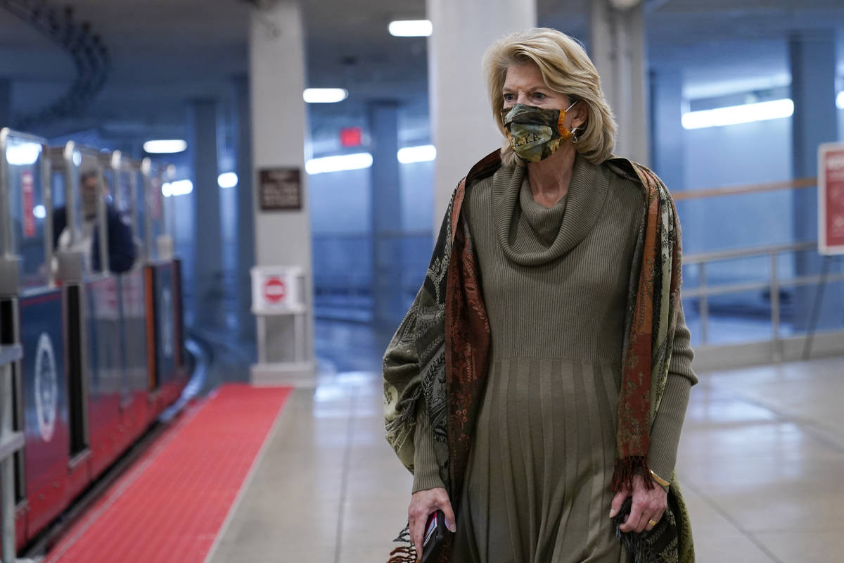 Sen. Lisa Murkowski, R-Alaska, walks on Capitol Hill in Washington, Wednesday, Feb. 10, 2021, d ...