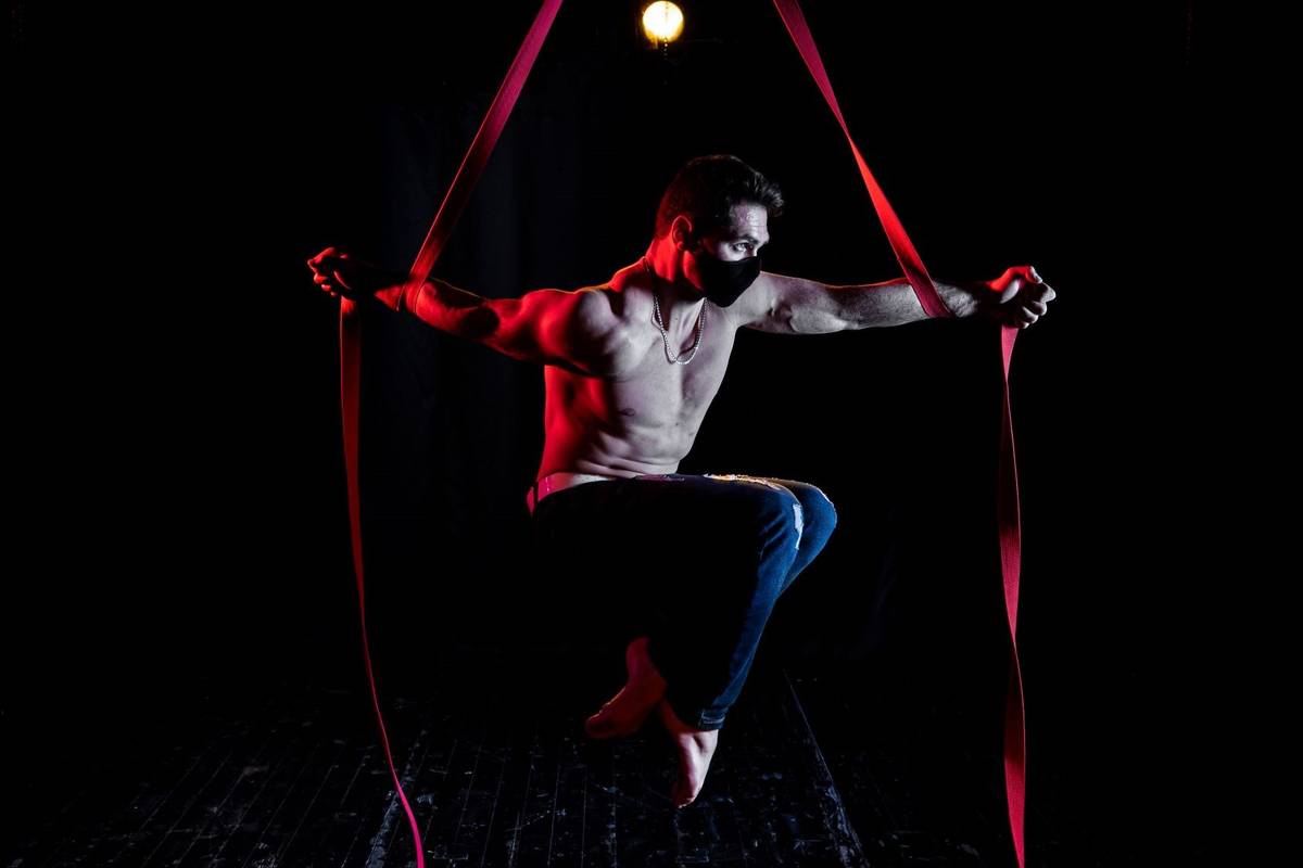 Roman Tomanov rehearses on aerial straps for the Apero show on the Baobab Stage on Thursday, Fe ...