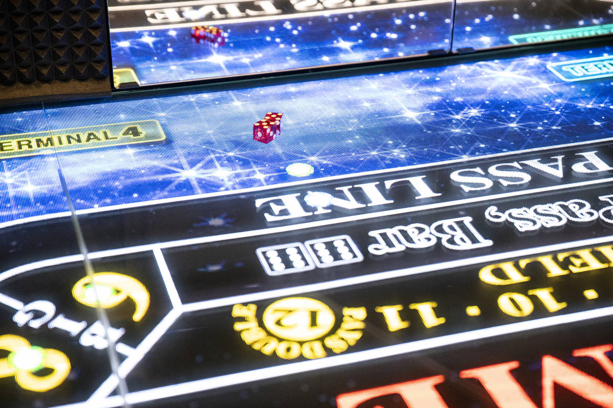 Dice on the new digital crap table, Rolls to Win Craps, at the Harrah's Las Vegas hotel-casino ...