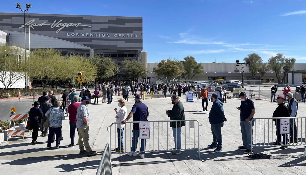 People line up for the second dose of the COVID-19 vaccine outside the Las Vegas Convention Cen ...