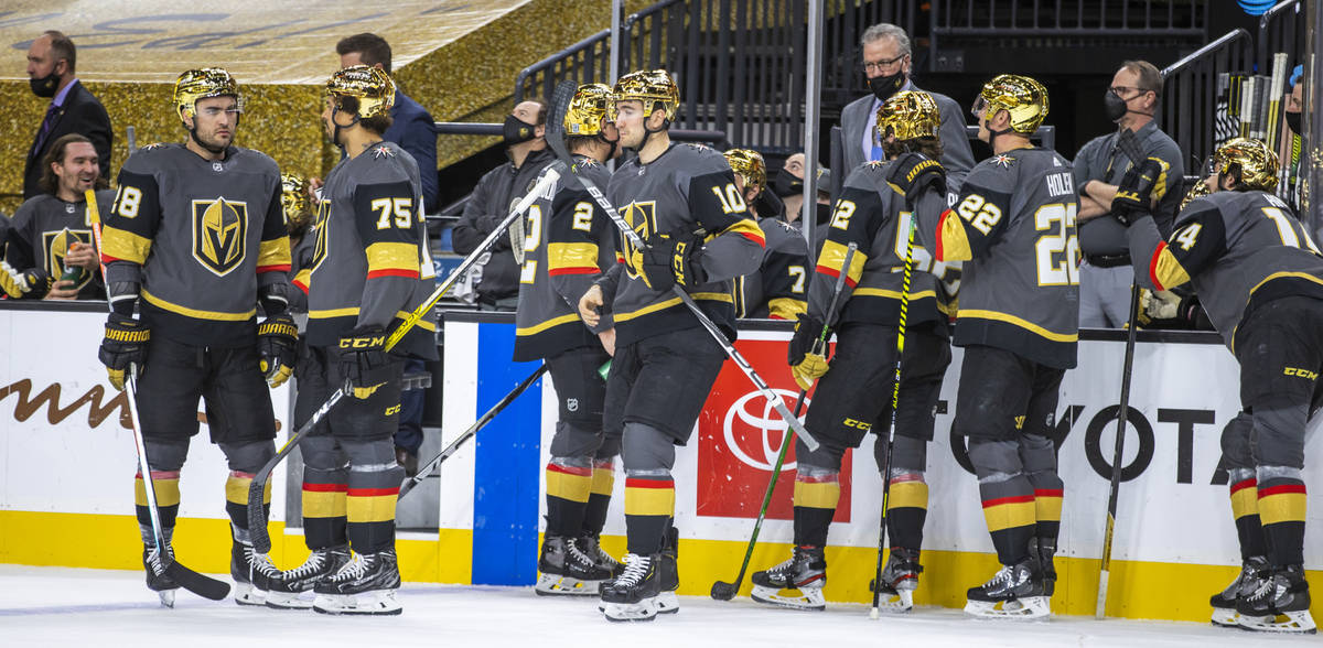 Golden Knights players and their new helmets versus the Anaheim Ducks during a timeout in the f ...