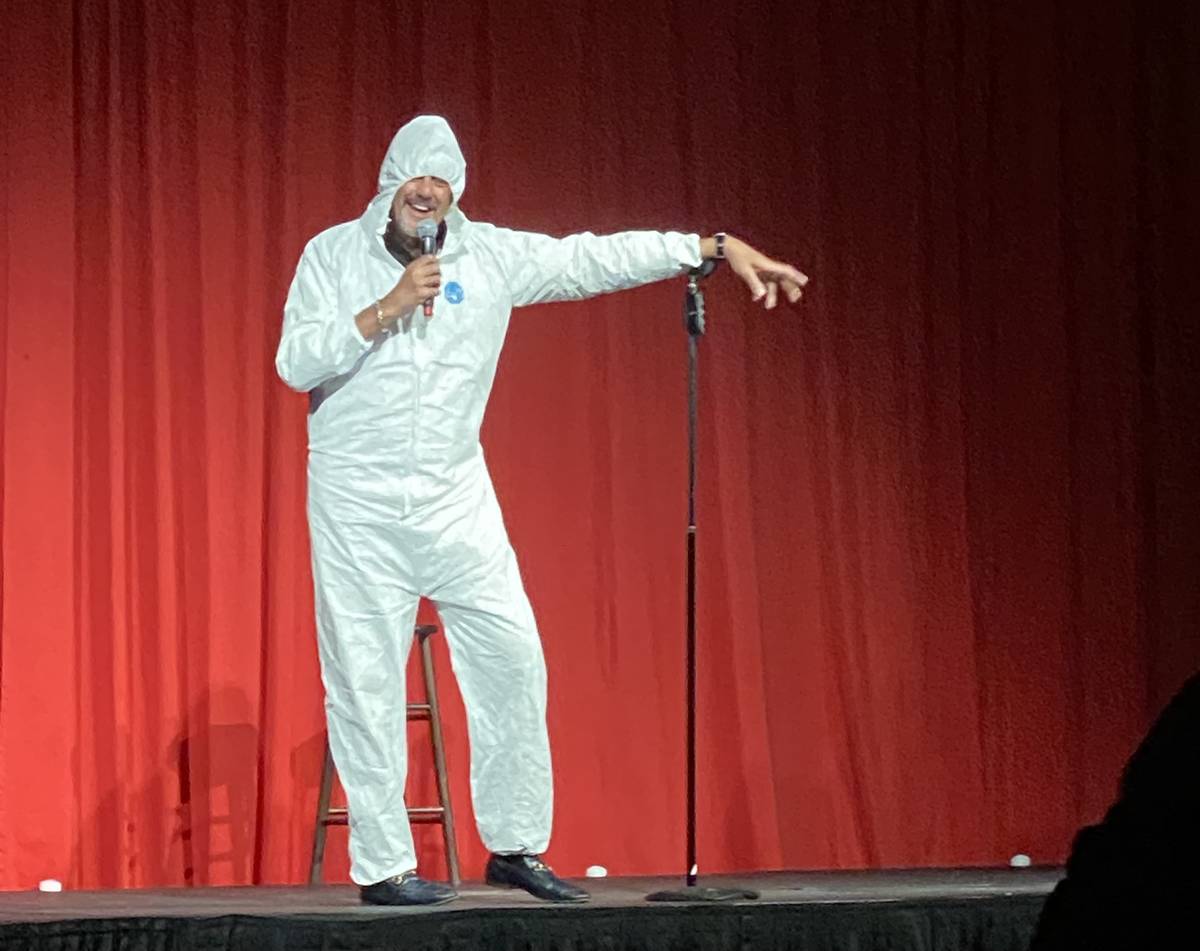 Brad Garrett is shown wearing his protective hazmat suit at the reopening of his Brad Garrett's ...