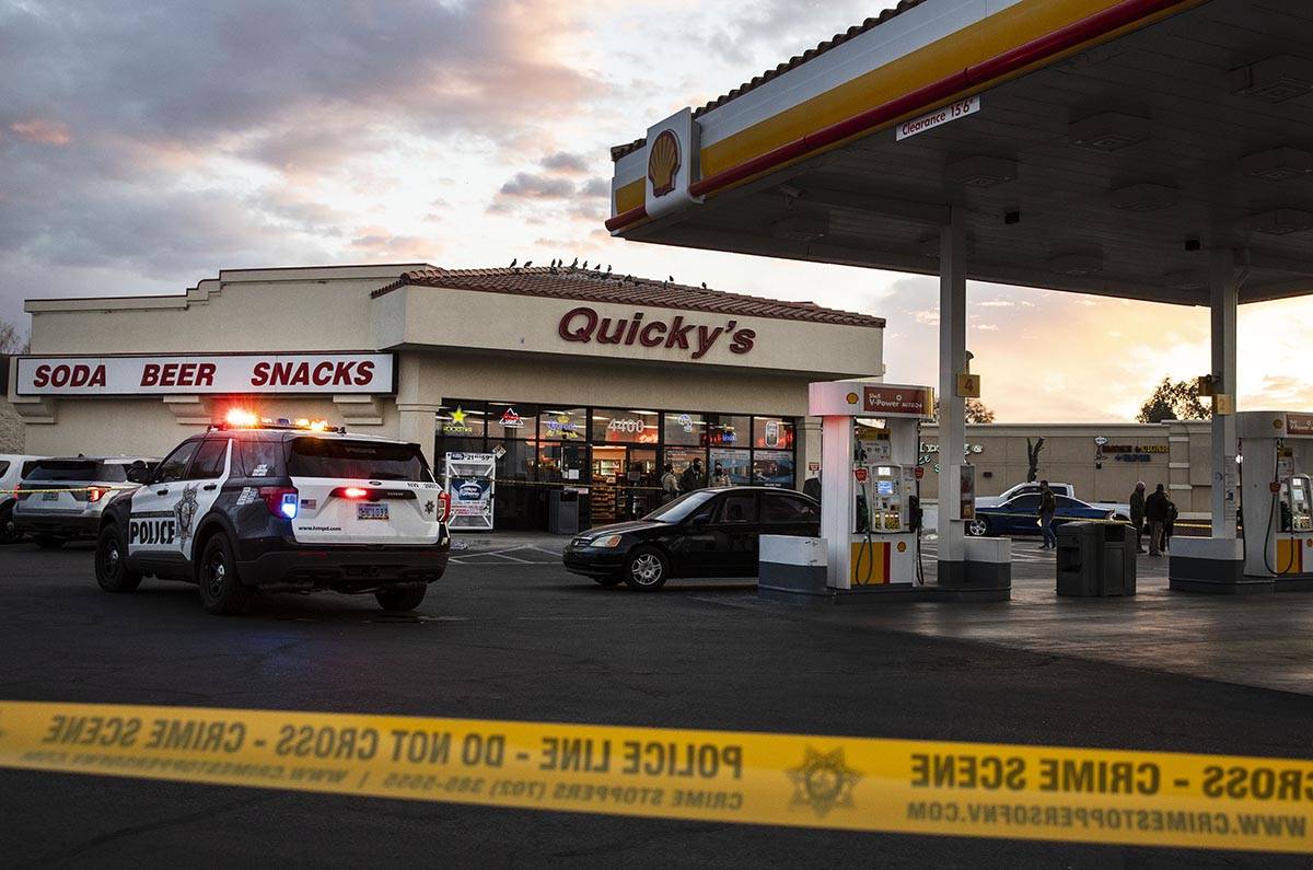 Police cordoned off the parking lot of the Quicky’s Shell station at Jones Boulevard and ...