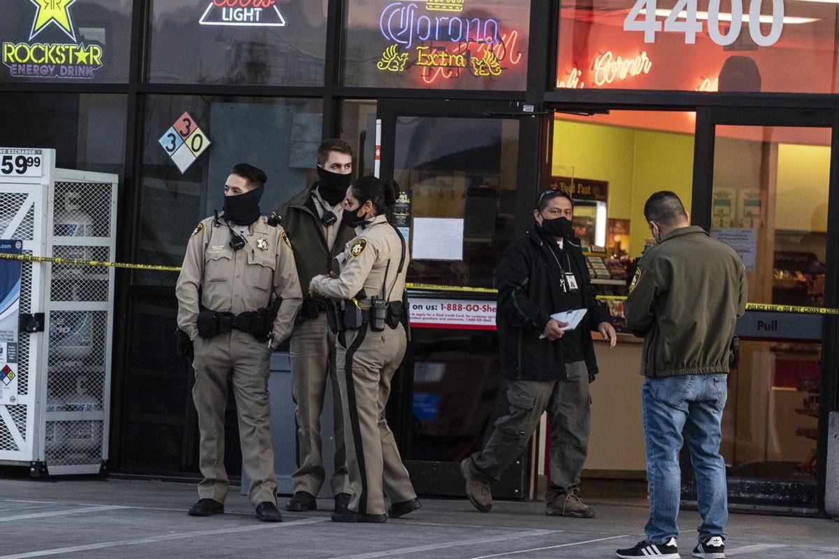 Police cordoned off the parking lot of the Quicky’s Shell station at Jones Boulevard and ...