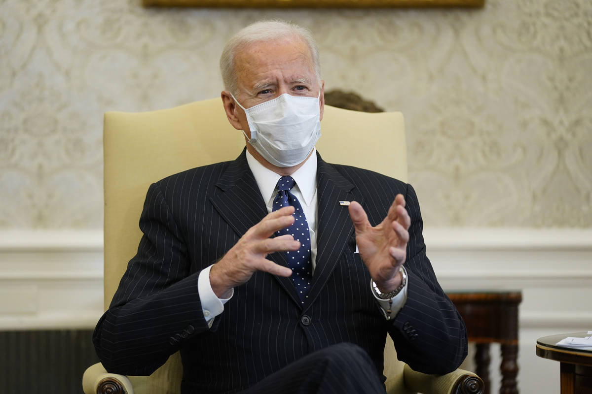 In a Feb. 9, 2021, photo, President Joe Biden meets with business leaders to discuss a coronavi ...