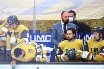 Golden Knights head coach Pete DeBoer talks with his team at the start an NHL hockey game again ...