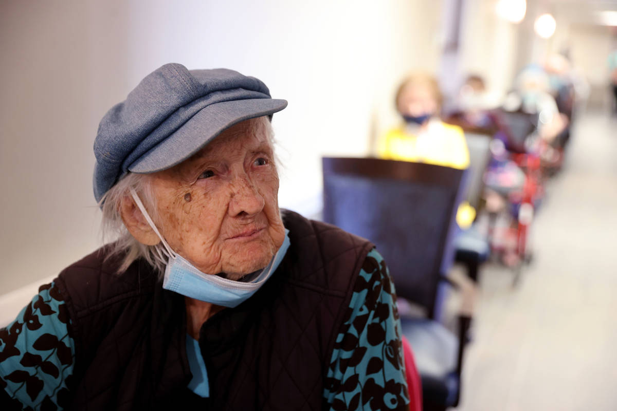 Valmae Ayres, 98, waits in line for the COVID-19 vaccine during an in-house clinic at Oakmont o ...