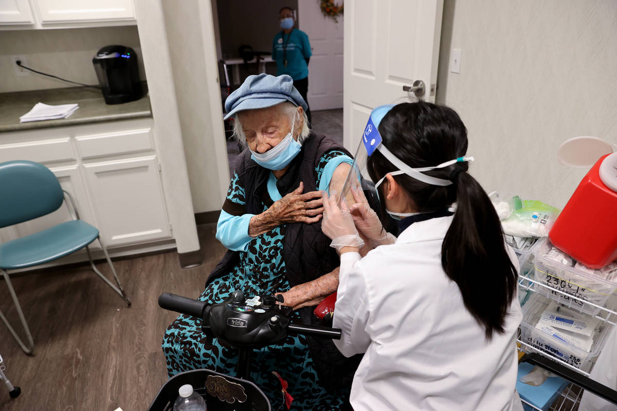 Valmae Ayres, 98, receives the Pfizer COVID-19 vaccine during an in-house clinic at Oakmont of ...