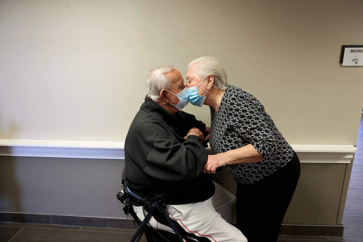 Don Masterson, 90, and Darlene Cox, 91, wait in line for the COVID-19 vaccine during an in-hous ...