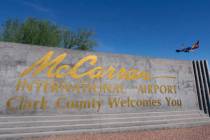 McCarran International Airport sign is seen as a Southwest Airways plane prepares to land in th ...