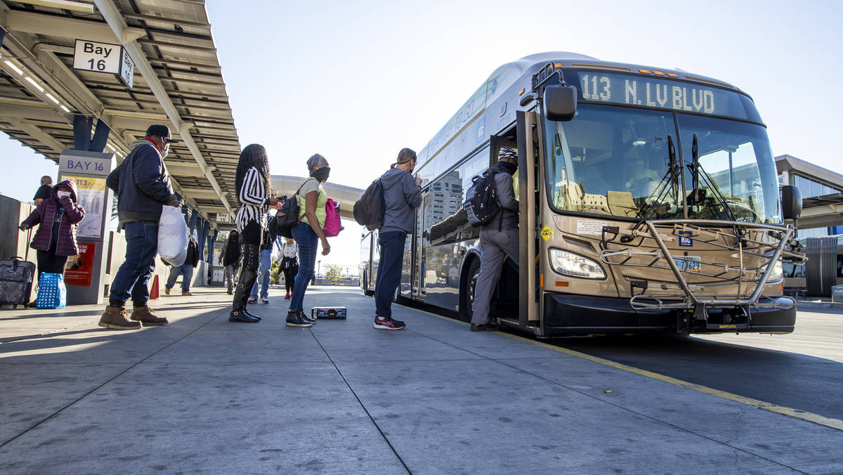 Passengers board a bus at the Bonneville Transit Center operated by the Regional Transportation ...