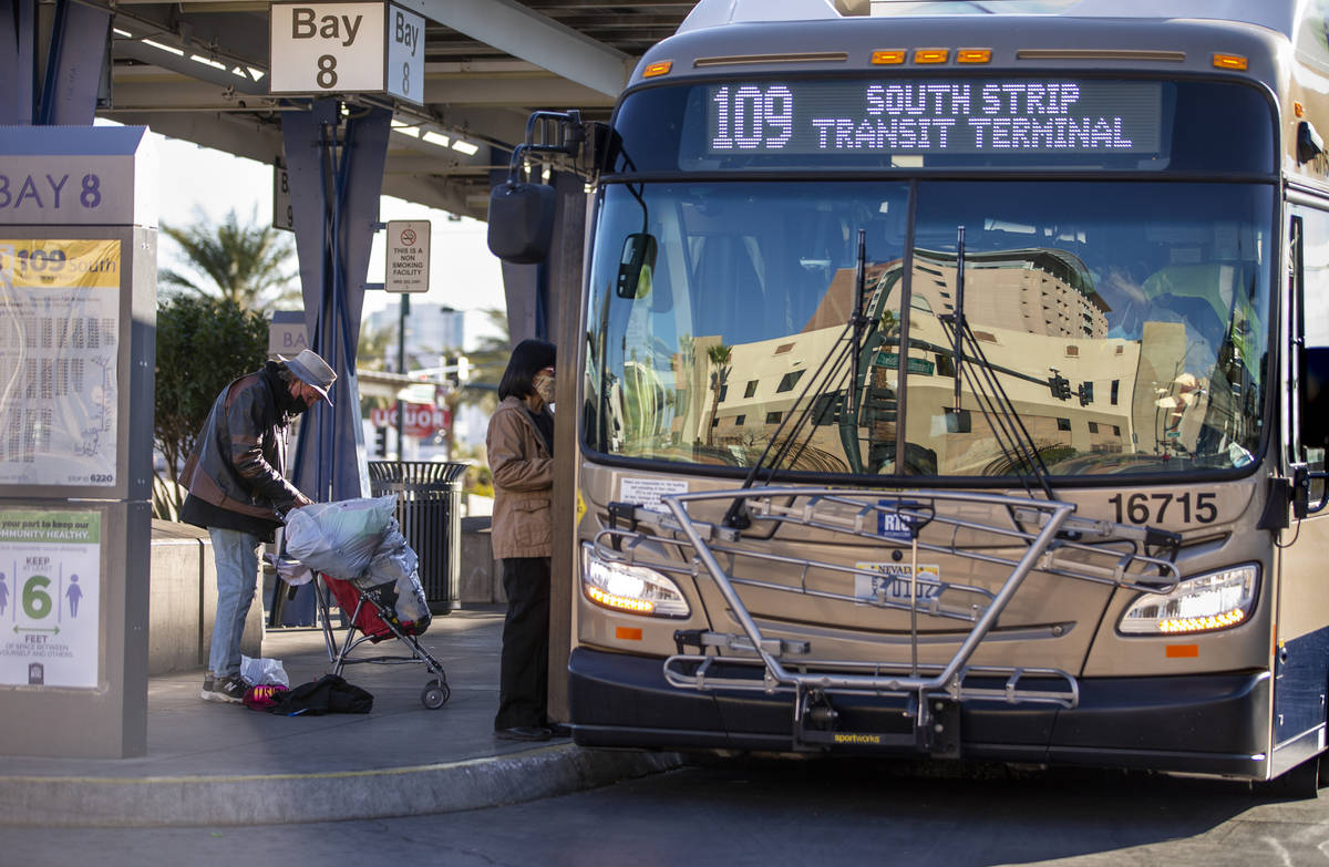 A nearby building is reflected in the front window of a bus at the Bonneville Transit Center op ...