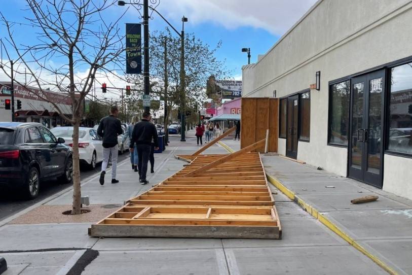 Wind damage is seen in downtown Las Vegas on Saturday, Feb. 13, 2021. A temporary wall was blow ...