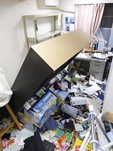 Furniture falls following an earthquake in Koriyama, Fukushima prefecture, northeastern Japan S ...