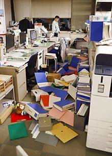 Files are scattered on the floor following an earthquake at a town office in Hironomachi, Fukus ...