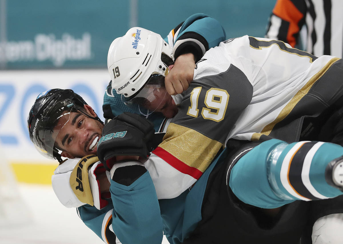 San Jose Sharks left wing Evander Kane (9), bottom, fights with Vegas Golden Knights right wing ...