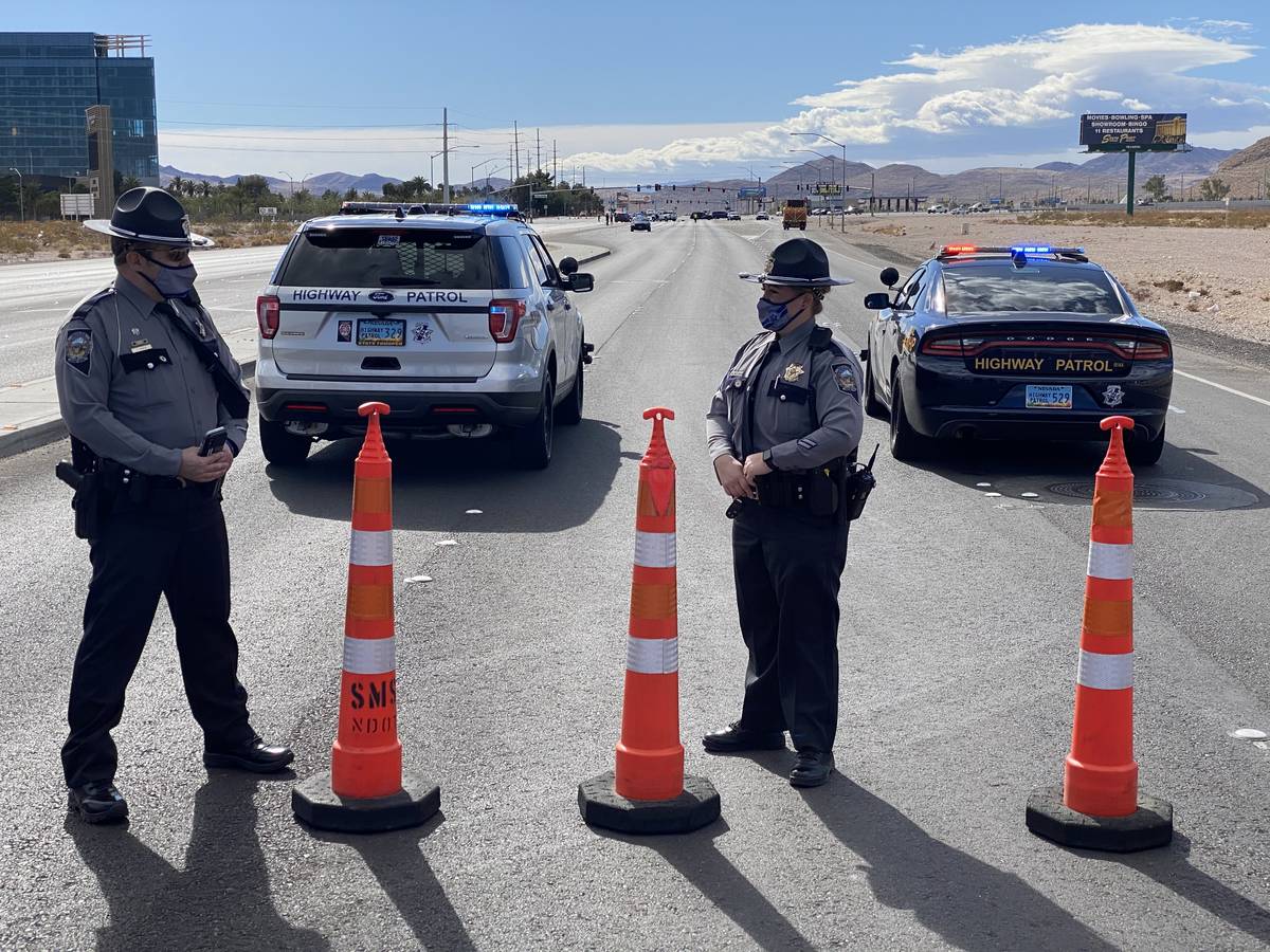 A street is blocked by police after a fatal crash Saturday, Feb. 13, 2021, at Las Vegas Bouleva ...