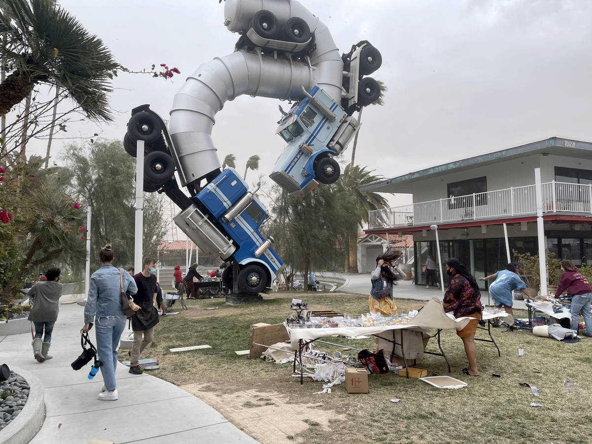 Vendors brace during sudden high winds at Fergusons Downtown in Las Vegas Saturday, Feb. 13, 20 ...