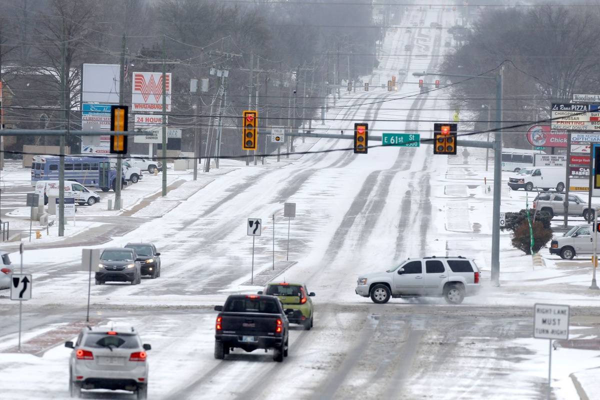 Snow covered city streets including at 61st and Sheridan in Tulsa as a winter storm moves in to ...
