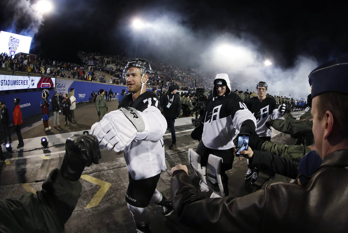 Cadets congratulate Los Angeles Kings center Jeff Carter, left, goaltender Calvin Petersen and ...