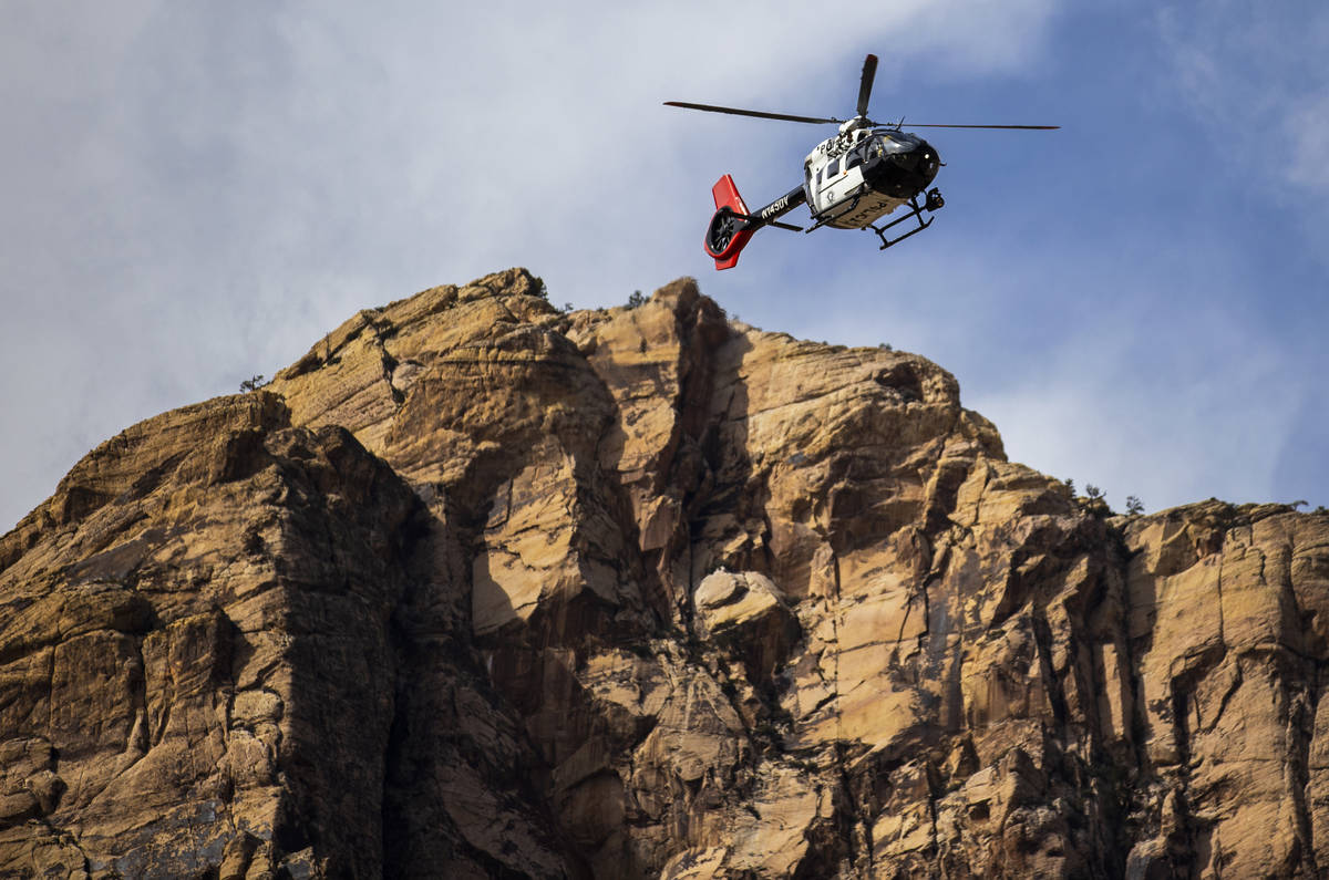 A Metropolitan Police Department search and rescue helicopter prepares to extract a climber tha ...