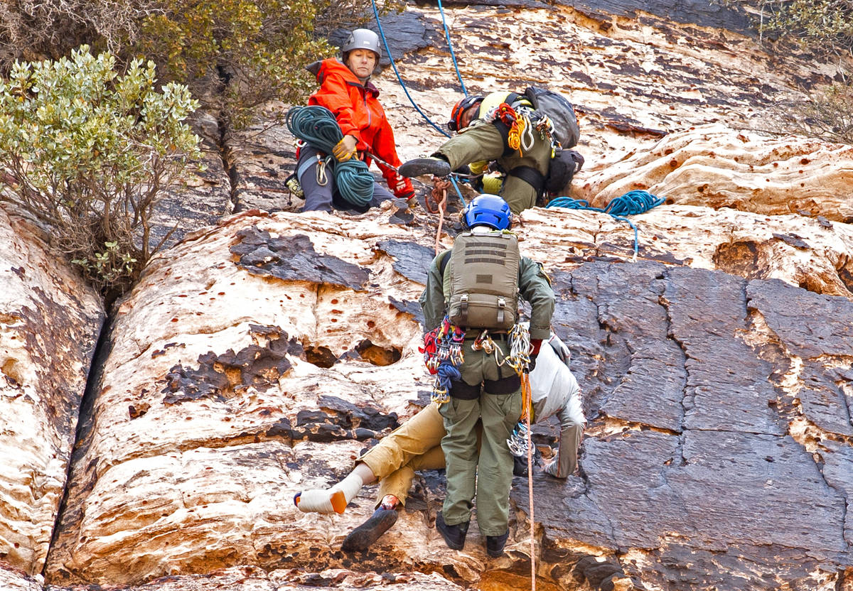 Metropolitan Police Department search and rescue lowers a climber to an extraction point after ...