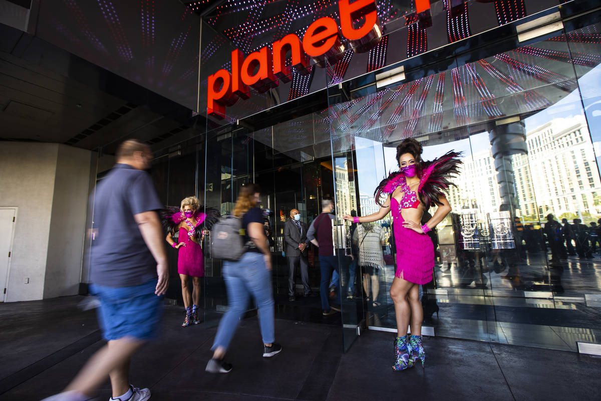 Guests head to the casino at Planet Hollywood Resort in Las Vegas on Thursday, Oct. 8, 2020. ( ...