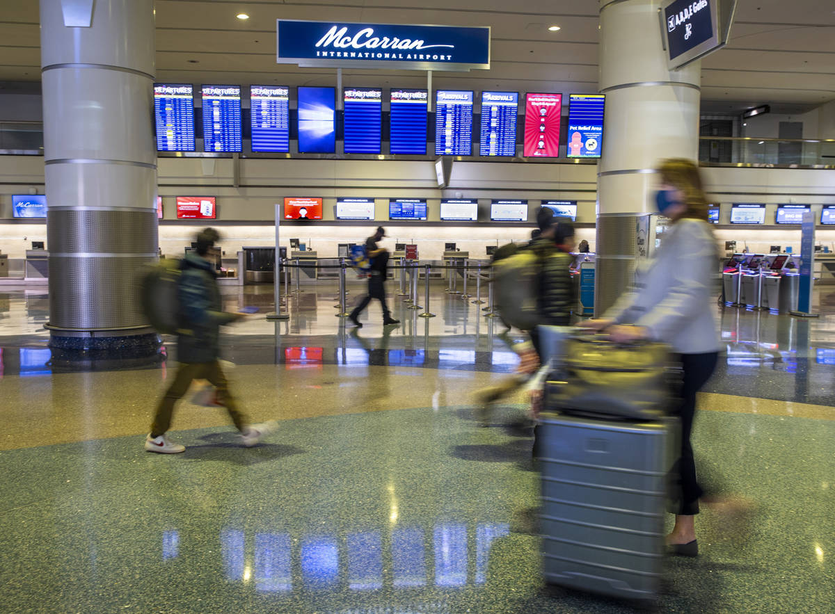 Visitors at the Terminal 1 ticketing area at McCarran International Airport which the Clark Cou ...