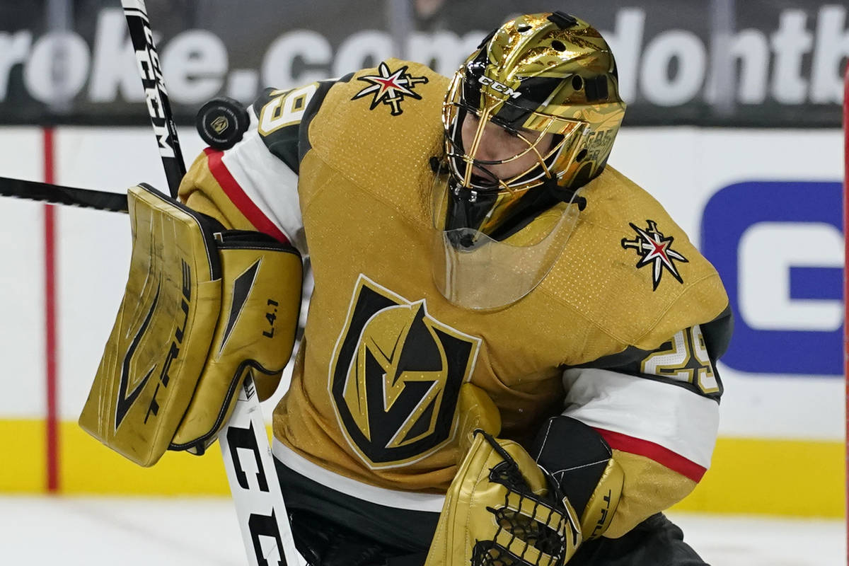 Vegas Golden Knights goaltender Marc-Andre Fleury (29) blocks a shot by the Colorado Avalanche ...