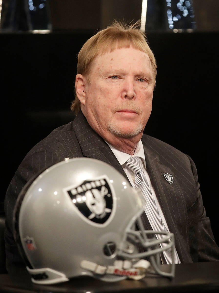 Oakland Raiders owner Mark Davis listens to speakers at a news conference announcing Mike Mayoc ...