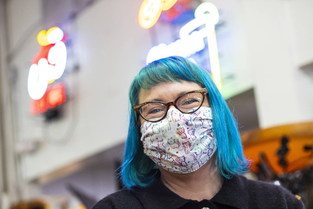 Renee Kowalsky, of Las Vegas, poses for a portrait with her custom cloth mask at the Antique Al ...