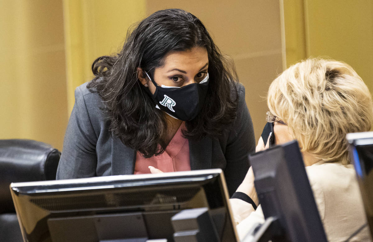 Las Vegas City Councilwoman Olivia Diaz wears double masks, left, as she talks with Las Vegas M ...