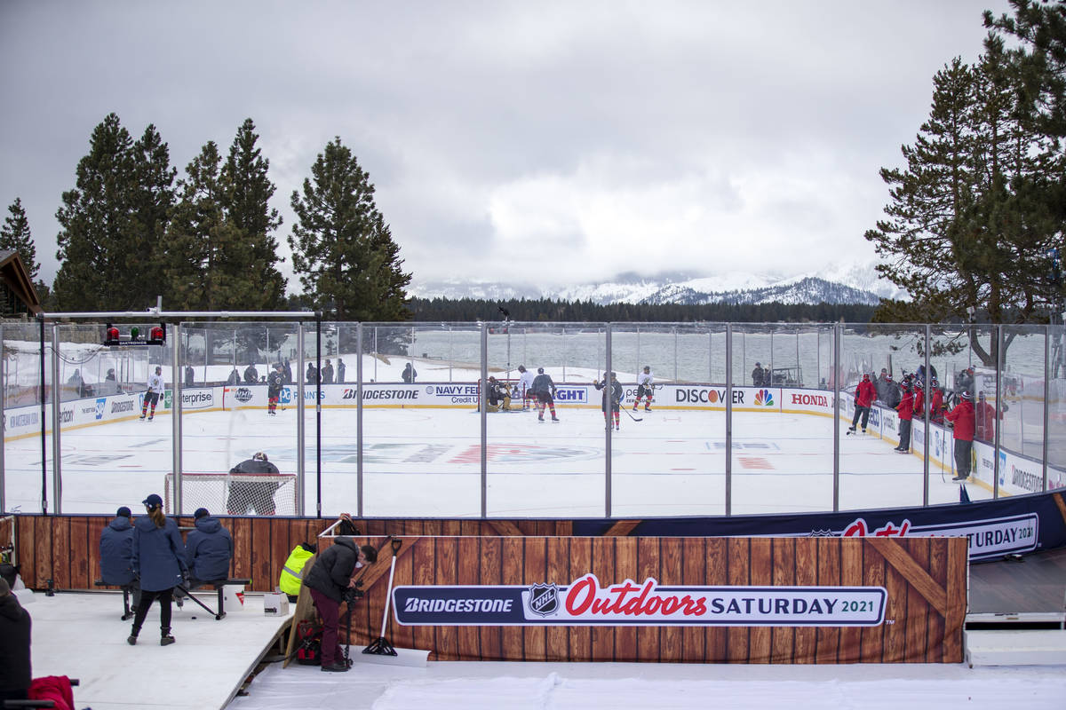 Vegas Golden Knights practice on an outdoor rink built over the 18th fairway of a golf course i ...