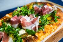 A pizza at Monzu. (Monzu Italian Oven + Bar)