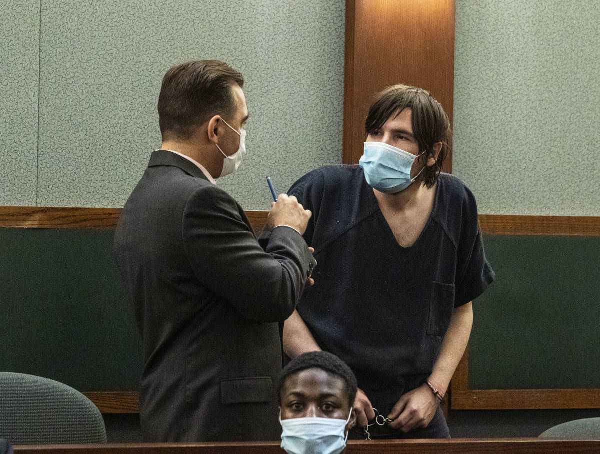 Defense attorney Dustin Marcello, left, consoles Brent Wilson, founding member of Panic! At the ...