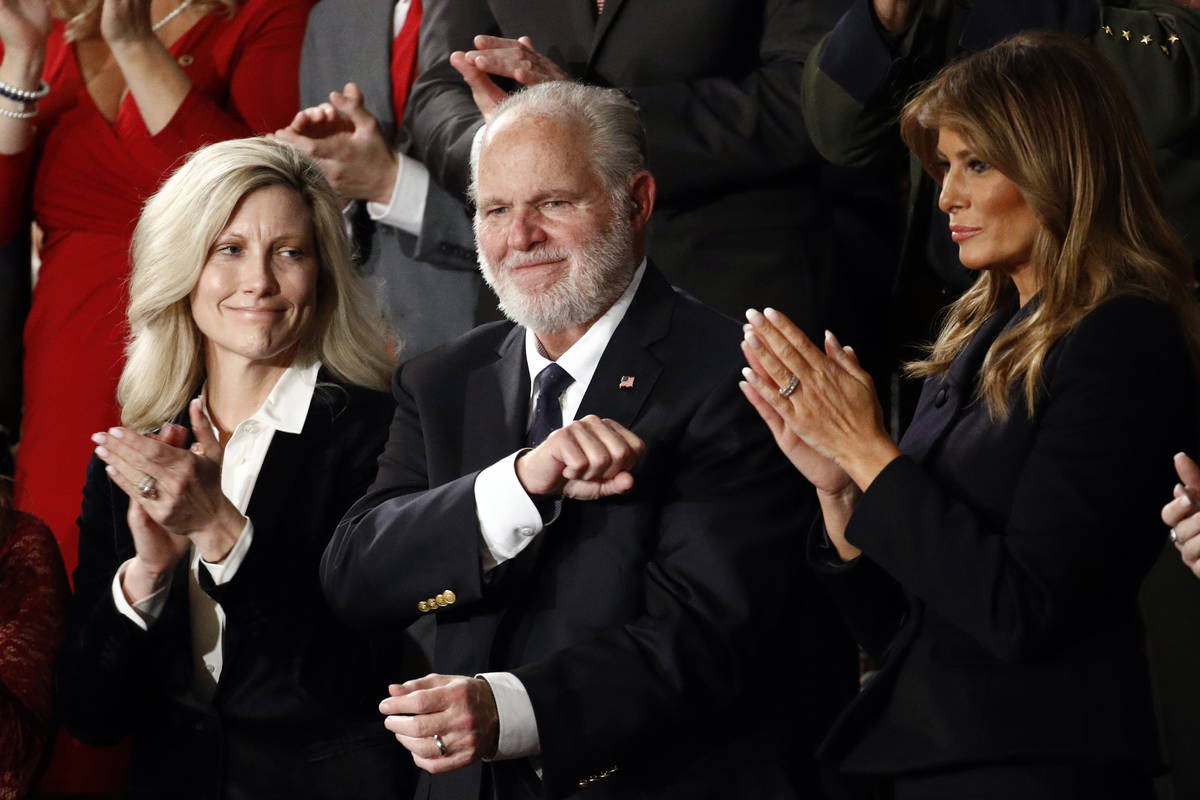 Rush Limbaugh reacts as first Lady Melania Trump, and his wife Kathryn, applaud, as President D ...