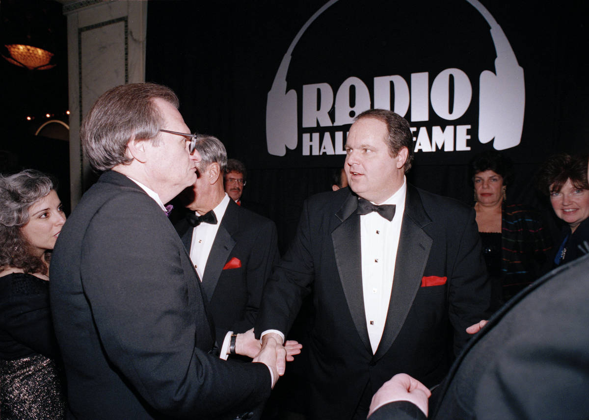 Radio host Rush Limbaugh, right, is congratulated by Larry King at the Radio Hall of Fame induc ...