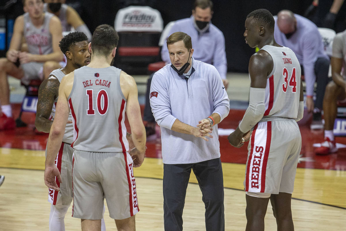 UNLV Rebels head coach T.J. Otzelberger coaches guard David Jenkins (5), forward Edoardo Del Ca ...