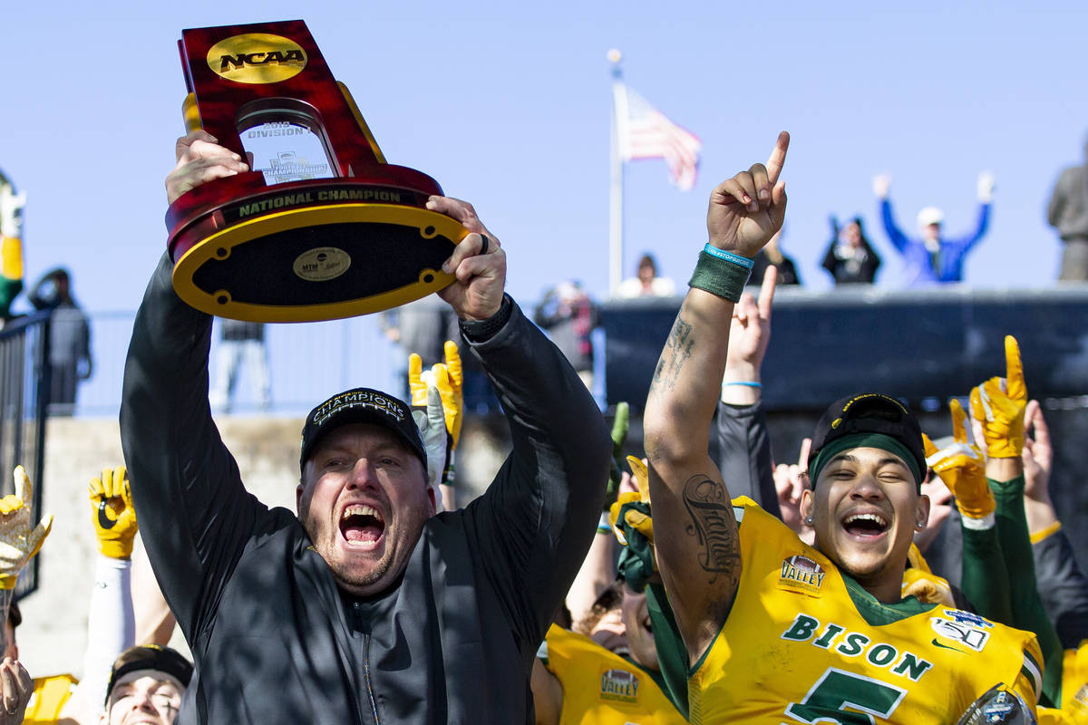 In this Jan. 11, 2020, file photo, North Dakota State head coach Matt Entz raises the trophy al ...