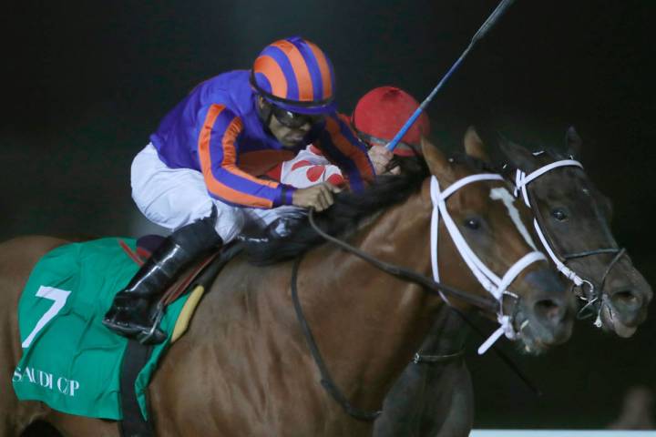 Jockey Luis Saez rides his horse, Maximum Security as he reaches the finish line of the $20 mil ...