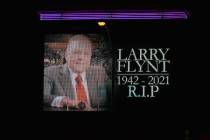 The screen located in the vicinity of the Hustler nightclub pays tribute to Larry Flynt, who re ...