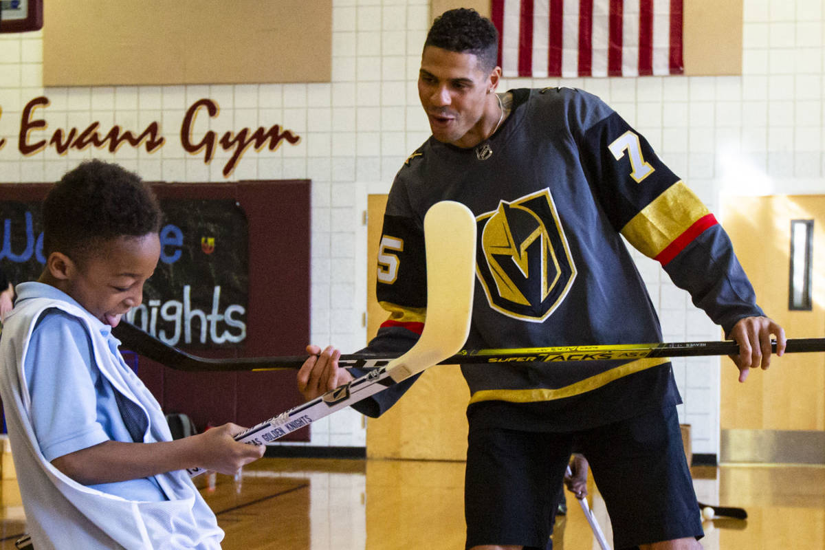 Vegas Golden Knights forward Ryan Reaves shows Javon Williams, 9, how to celebrate after scorin ...