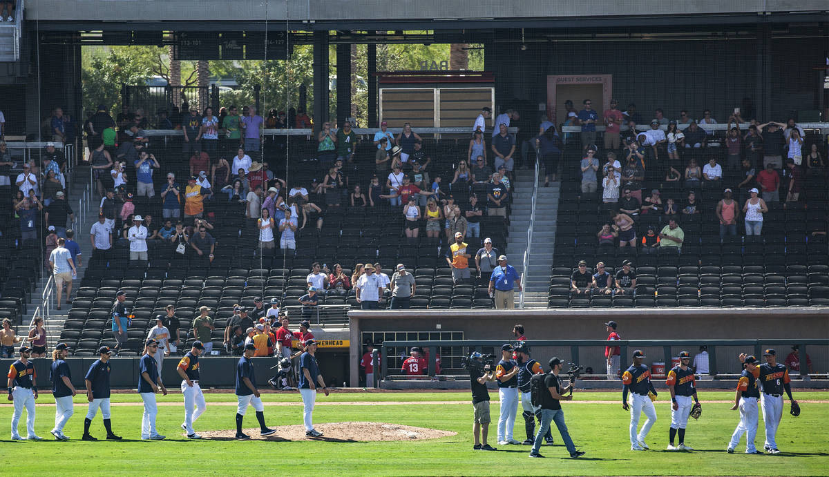 The Las Vegas Aviators walk the field after winning against the Tacoma Rainiers 3-2 in their fi ...